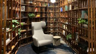 Bookshelves and grey chair.