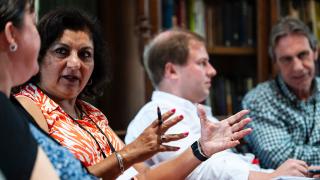 Woman talking to group.