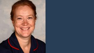 Jessica smiling wearing her nursing uniform