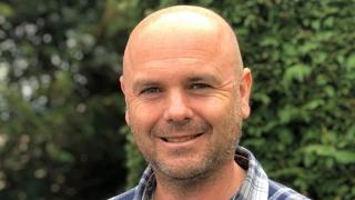 Gareth smiling outside