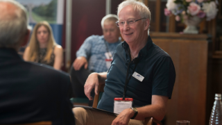 dr ed newell talking in a group
